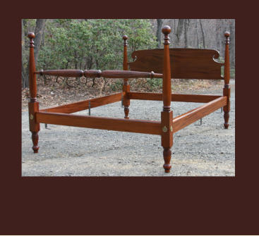 hand carved cannon ball bed in mahogany with quilt rail and scrolled headboard